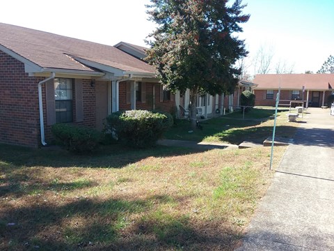 a house with a sidewalk in front of it